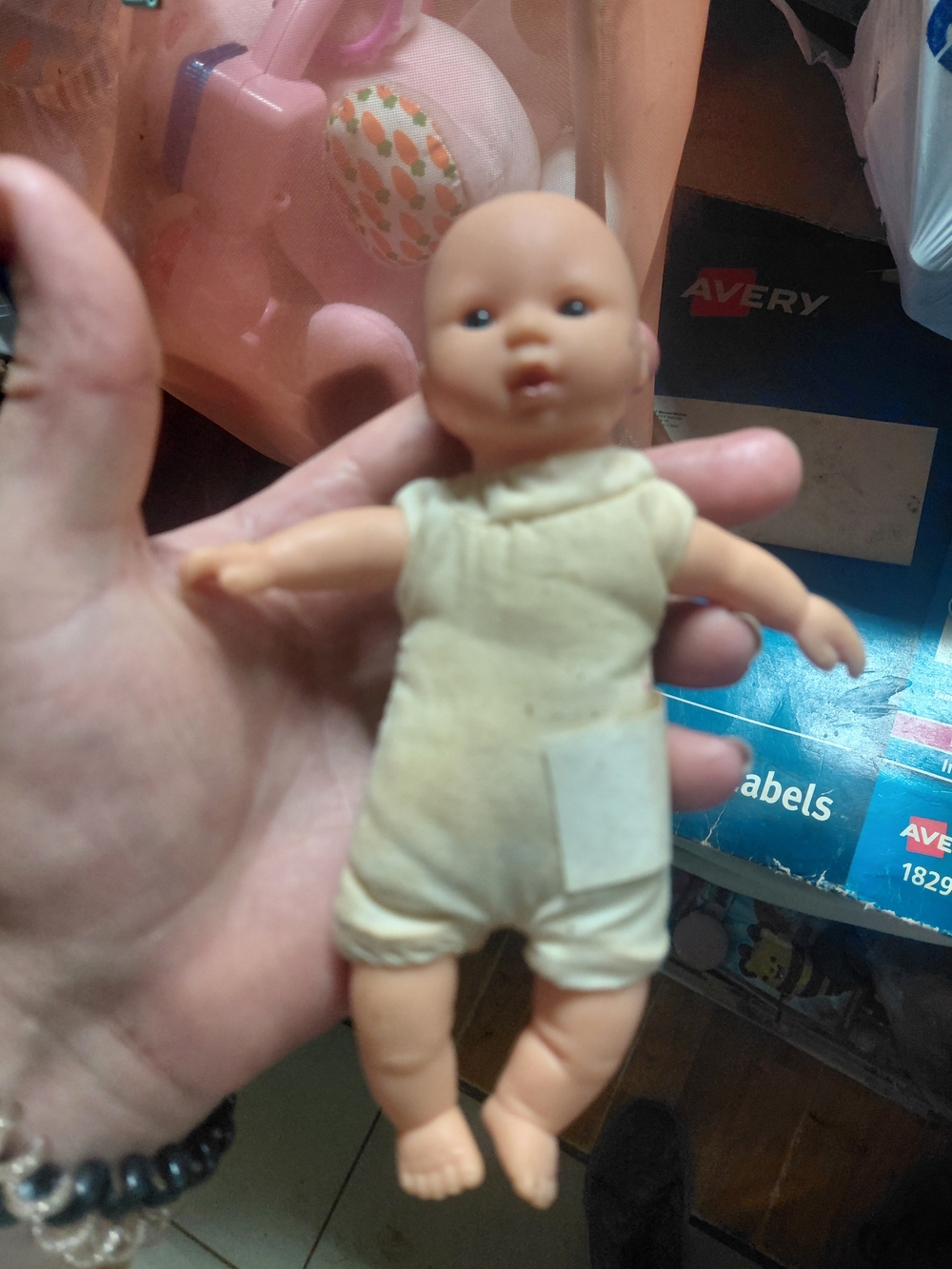 a vintage 1997 Corolle mini baby doll featuring blue eyes and a soft body.